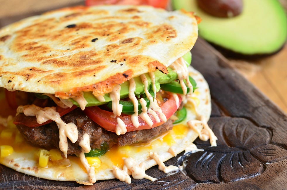 Quesadilla Burger with avocado tomato and fried tortilla as the bun 