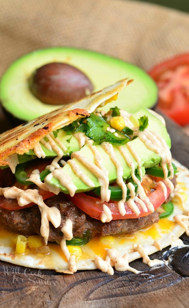 Quesadilla Burger with avocado tomato and fried tortilla as the bun 