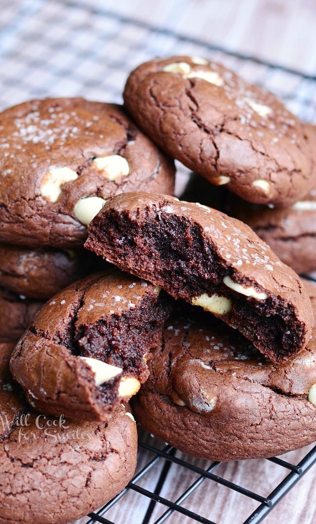 White Chocolate Brown Butter Chocolate Cookies on a cooling rack with one cookie torn in half 