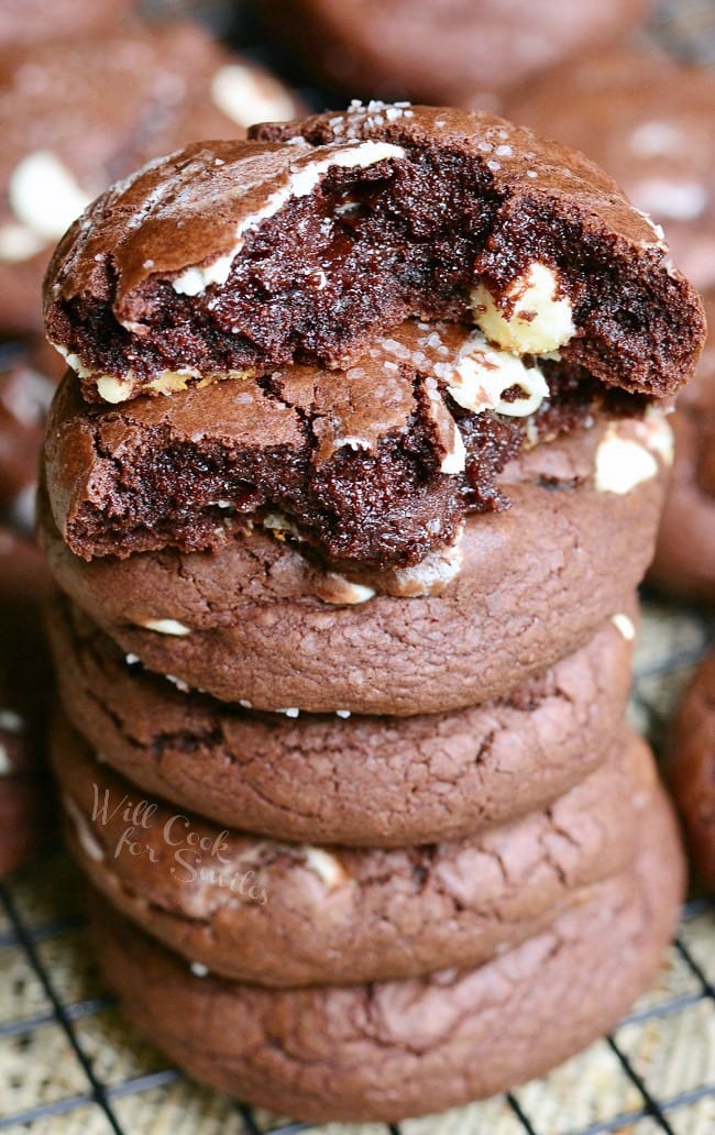 Salted Chocolate White Chocolate Chip Cookies stacked up with the top torn in half 