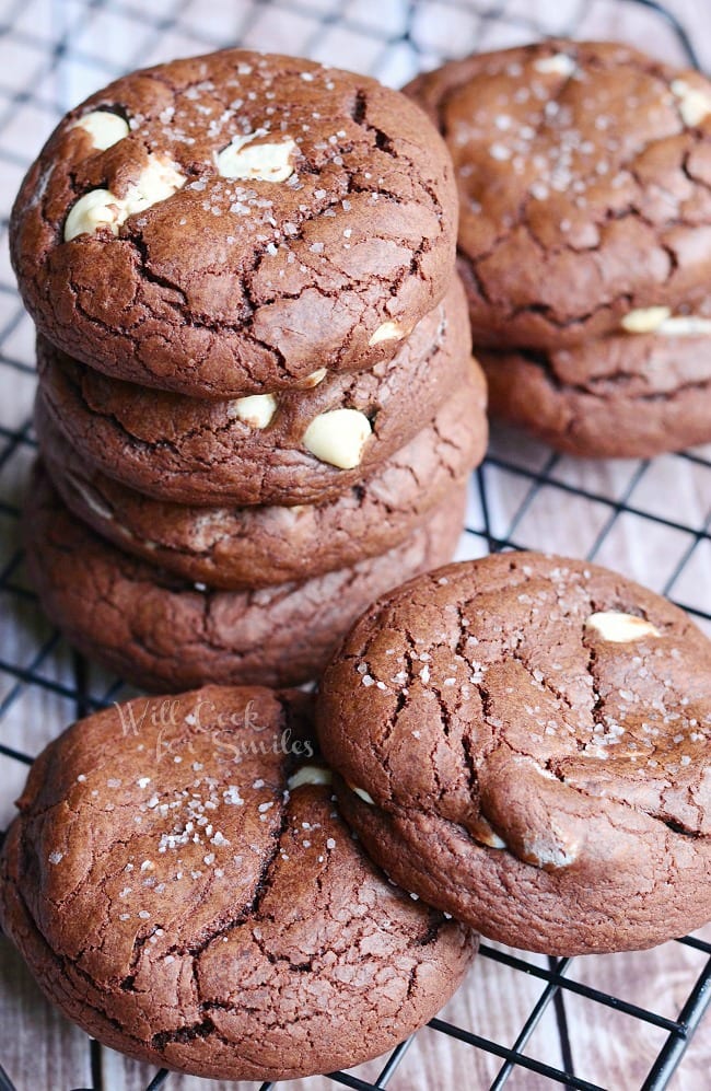 White Chocolate Brown Butter Chocolate Cookies stacked on top of each other on a cooling rack