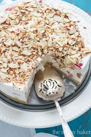 strawberry shortcake ice cream cake with sliced almonds on top 