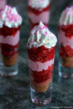 Strawberry shortcake cups with whipped cream on top and pink sprinkles 