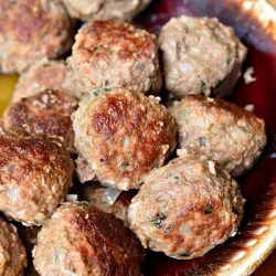 brown bowl filled with meatballs used for meatball subs