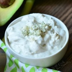 Close up view from above of a small white bowl with homemade blue cheese dressing