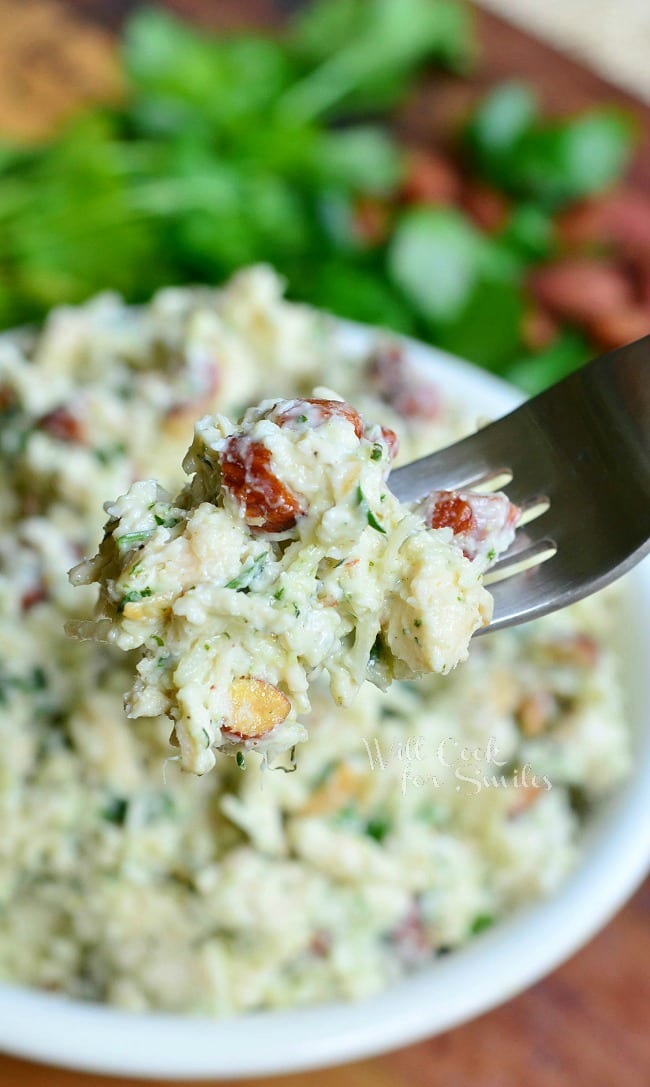 Italian Three Cheese Chicken Salad in a bowl with a fork lifting some out 