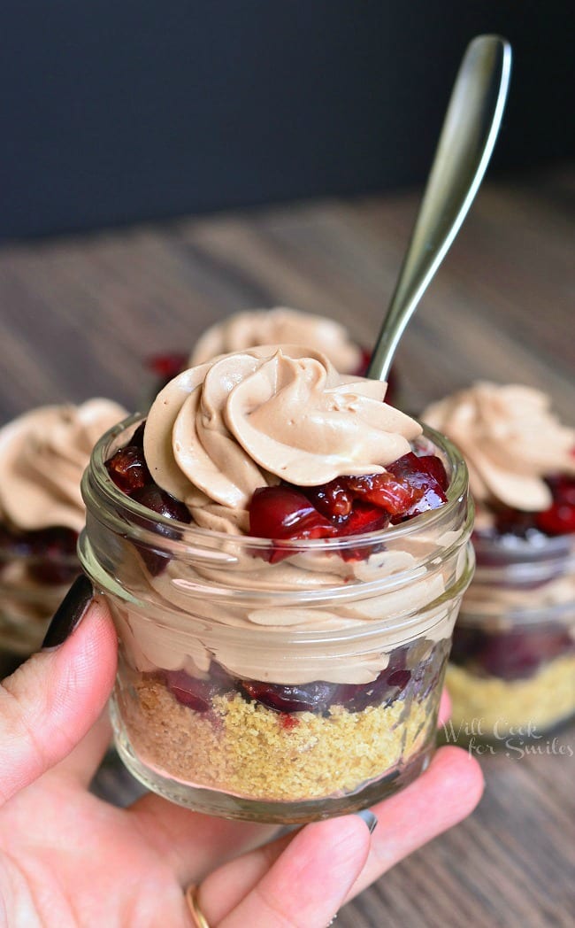 Holding the Chocolate Cherry Cheesecake Pie In A Jar 