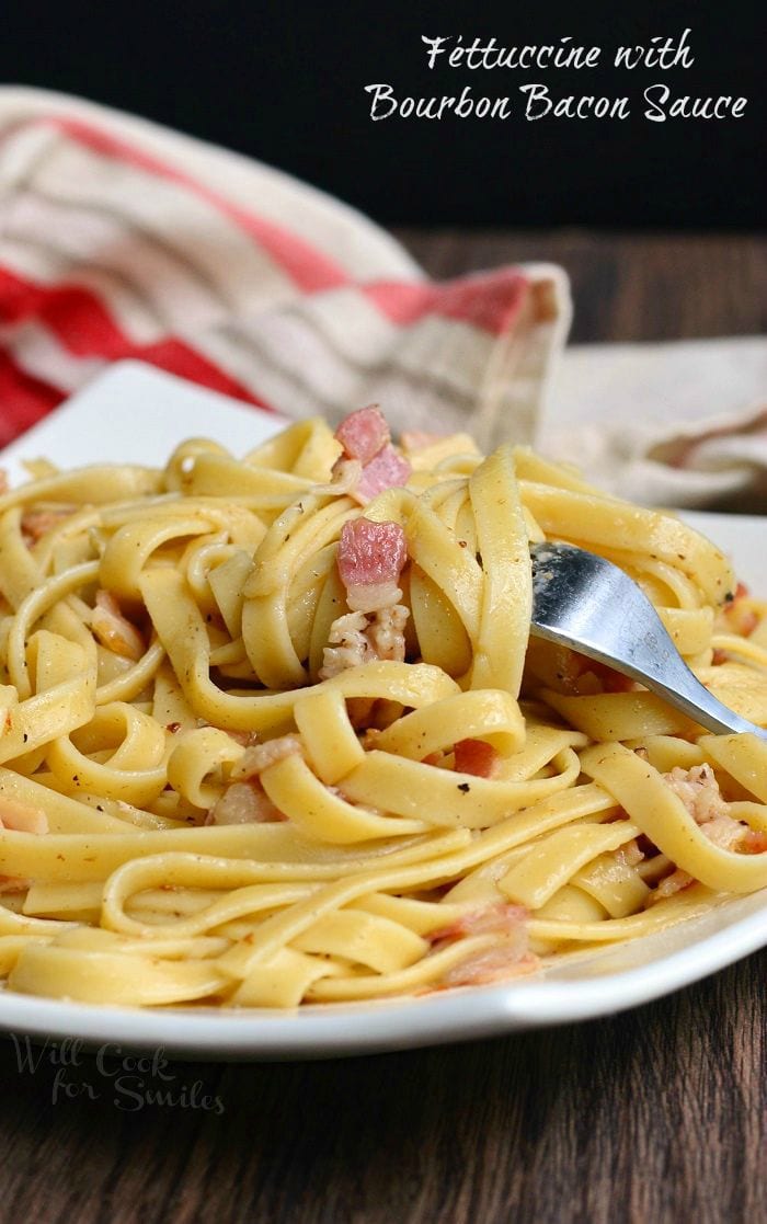 Fettuccine with Bourbon Bacon Sauce on a plate with a fork 