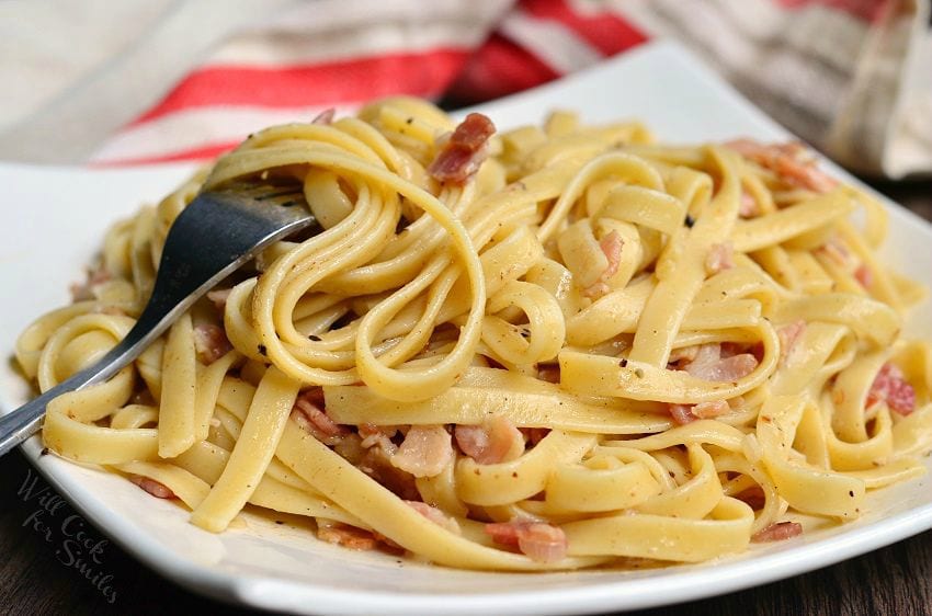 Fettuccine with Bourbon Bacon Sauce on a plate with a fork 