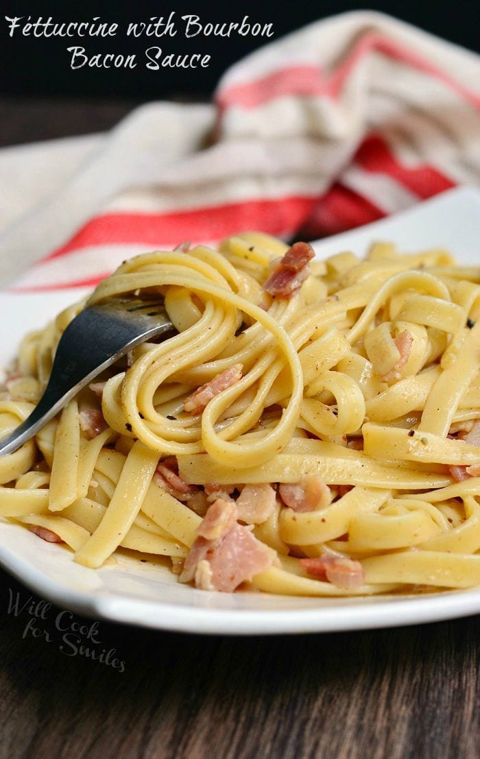 Fettuccine with Bourbon Bacon Sauce on a plate with a fork 