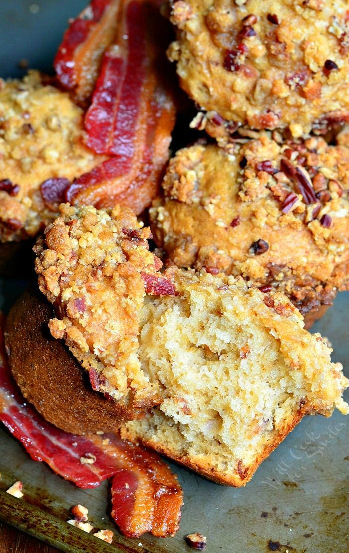 Maple Bacon Streusel Muffins with bacon slices on a baking sheet 