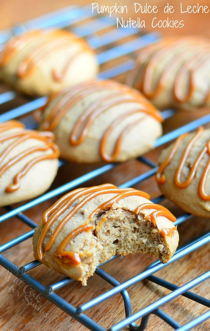 Pumpkin Dulce de Leche Nutella Cookies with dulce de leche swirled on top on a cooling rack 