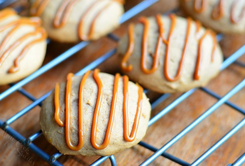 Pumpkin Dulce de Leche Nutella Cookies with dulce de leche swirled on top on a cooling rack 