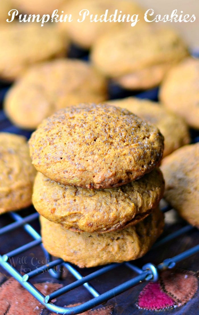 Pumpkin Pudding Cookies stacked on top of each other on a cooling rack 