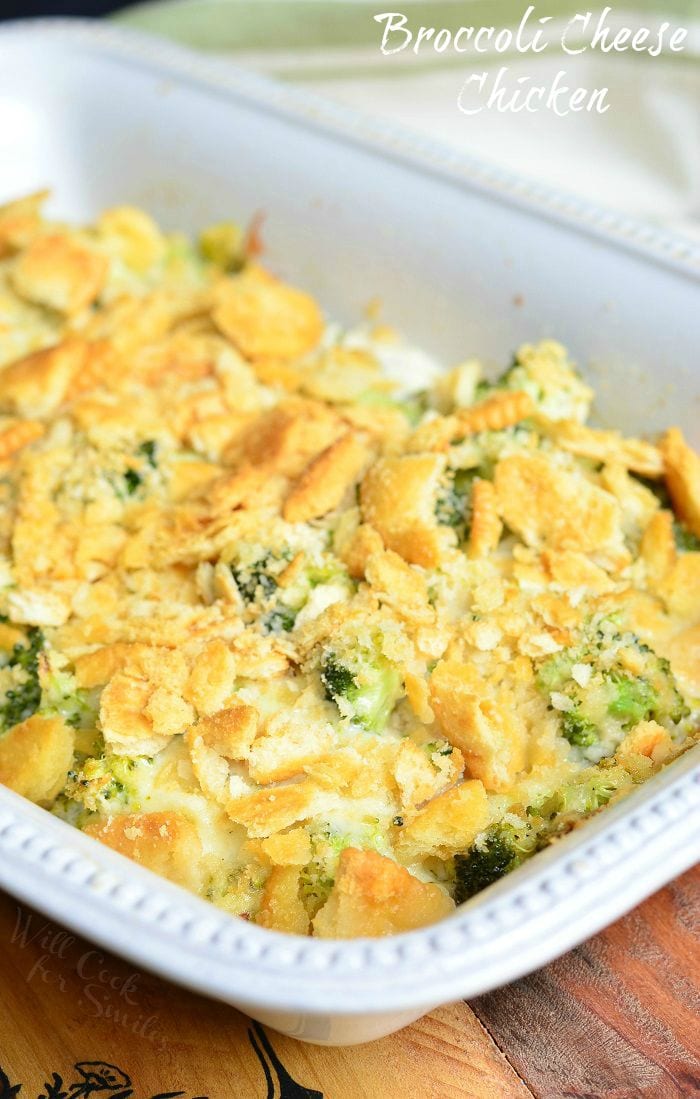 Broccoli Cheese Chicken with crumbled ritz crackers on top in a white casserole dish 