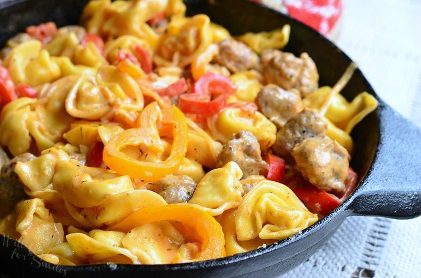 Sausage, Peppers, and Onion Tortellini in a cast iron skillet 