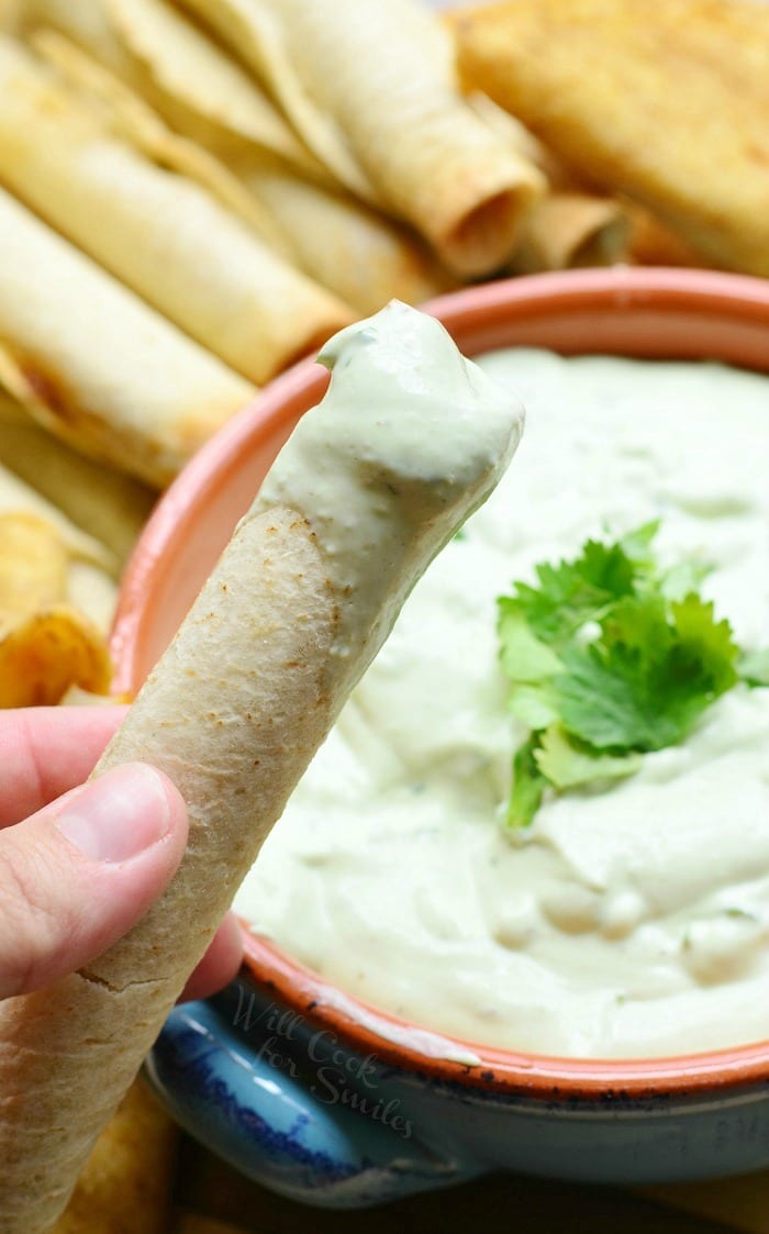 taquitos dipped in Avocado Ranch Dip 