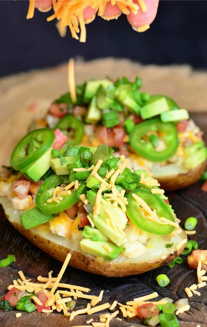 Twice Baked Potatoes with cheese, green onions, jalapenos, and avocado 