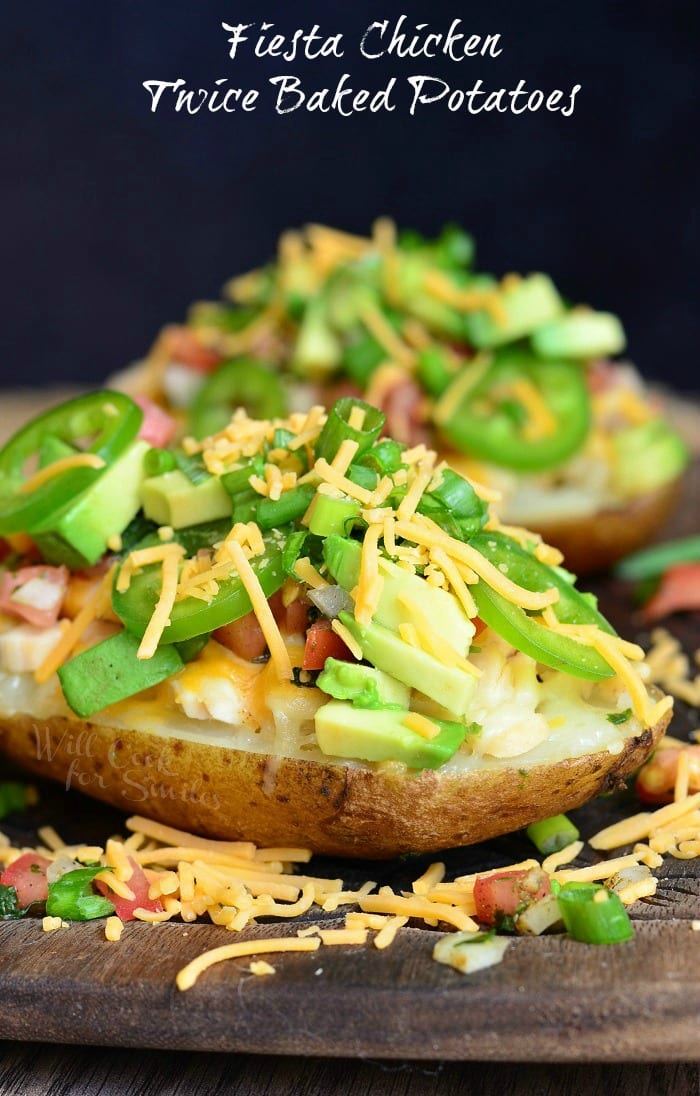 Twice Baked Potatoes with cheese, green onions, jalapenos, and avocado 