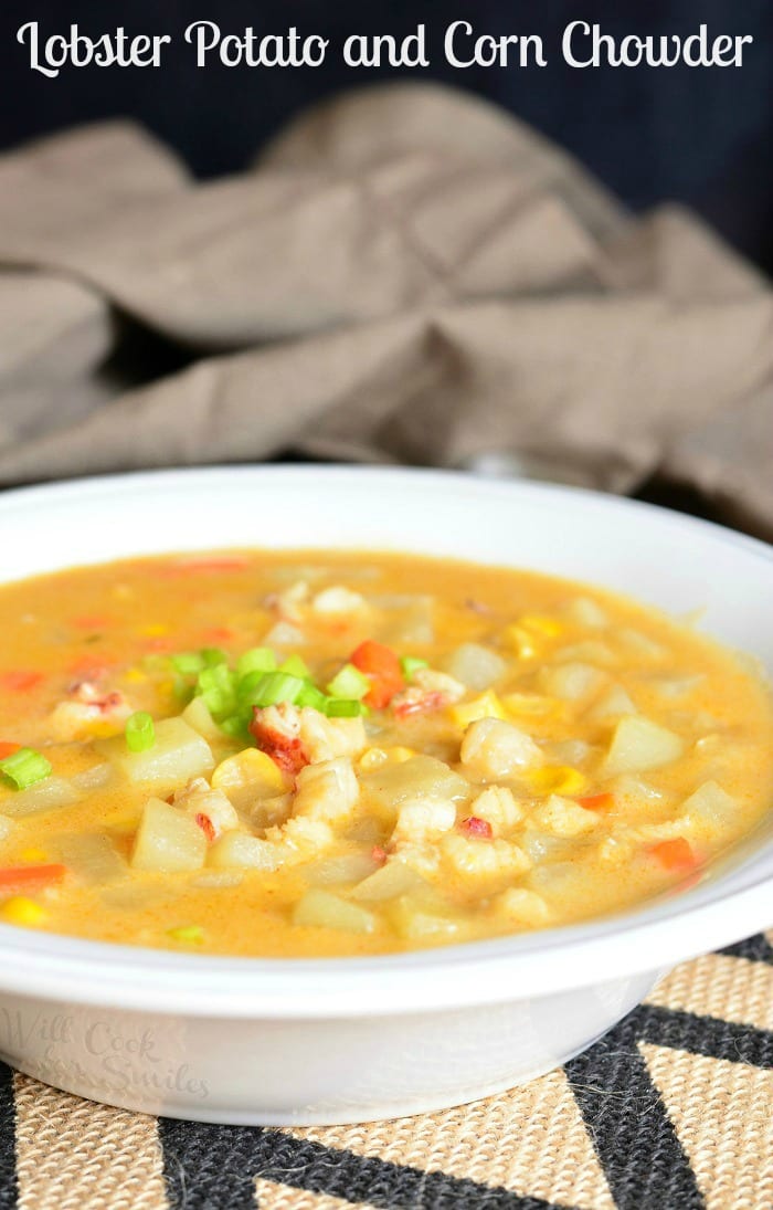 Lobster, Potato and Corn Chowder in a bowl with a spoon scooping some out 