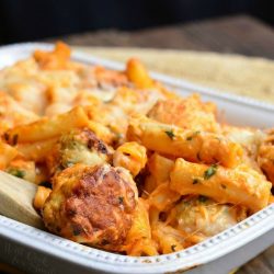 white baking dish filled with chicken meatball baked ziti on a wooden table