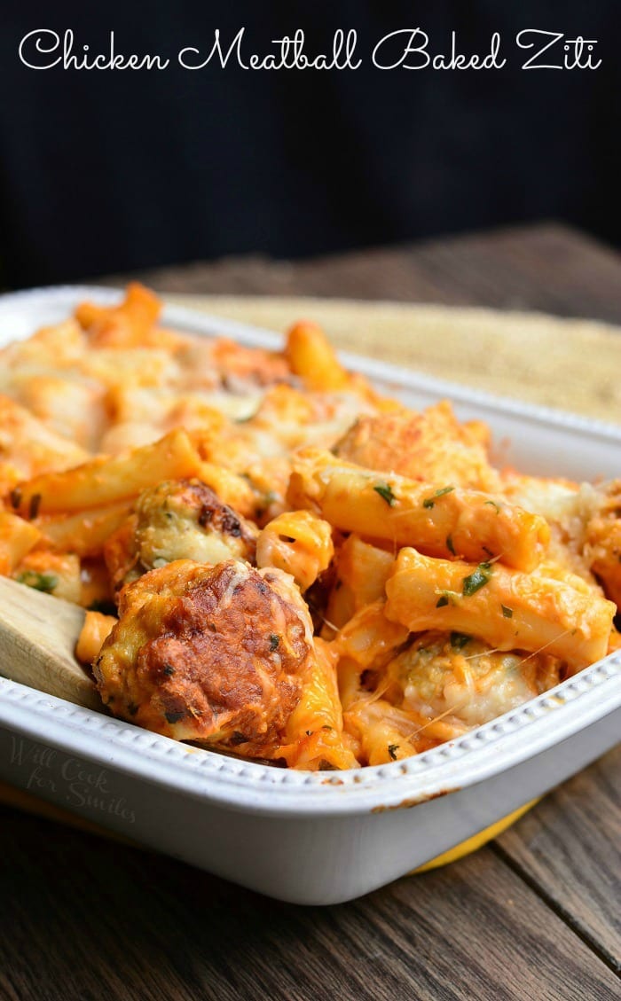 white baking dish filled with chicken meatball baked ziti on a wooden table