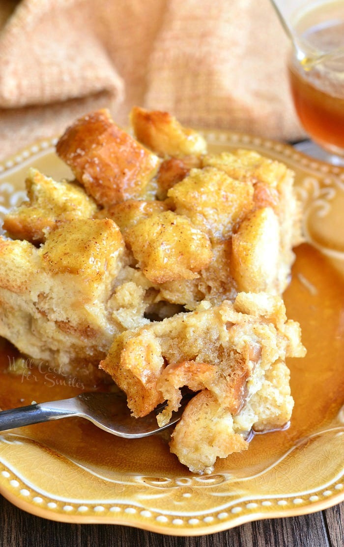 Eggnog Bread Pudding on a plate with a fork with bread pudding on it 