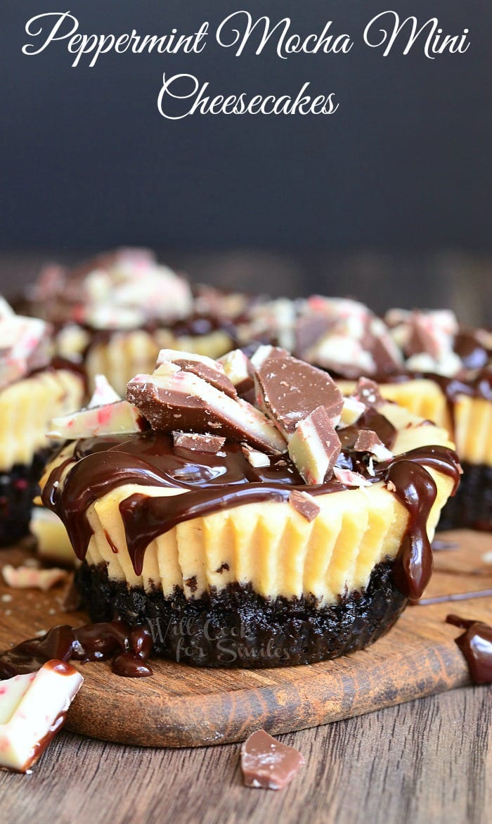 Peppermint Mocha MIni Cheesecakes with peppermint candy on top on a cutting board 