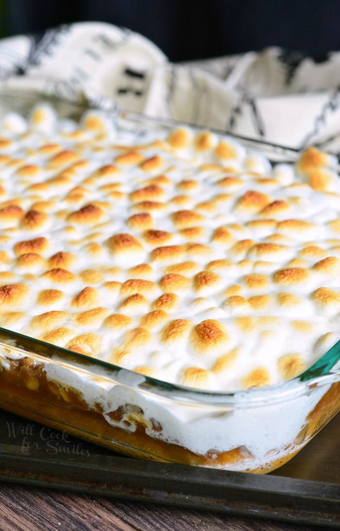 Sweet Potato Casserole with melted marshmallows on top Cake in a glass baking dish 