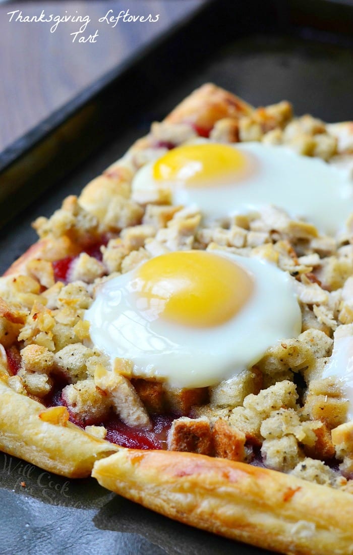 Thanksgiving Leftovers Tart with Turkey, Stuffing, Cranberry and Egg  on a baking sheet 