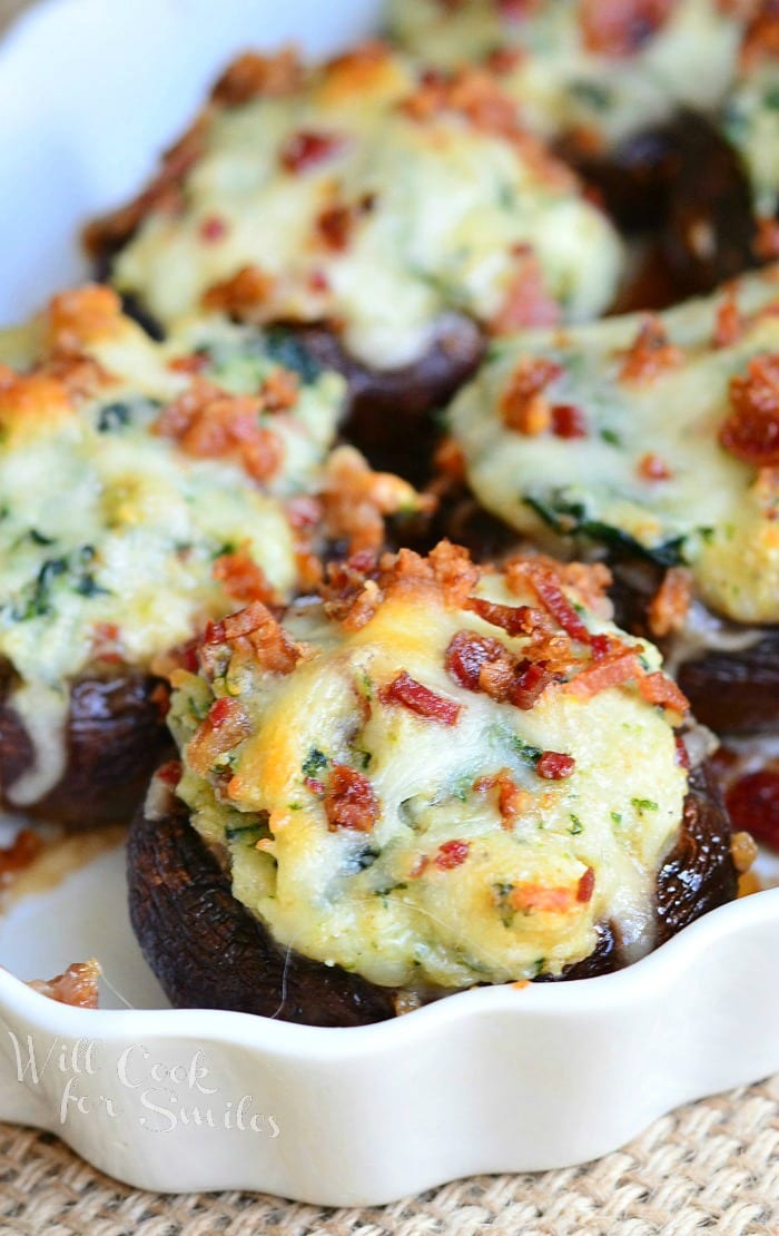 Bacon Spinach and Four Cheese Stuffed Mushrooms on a serving platter 