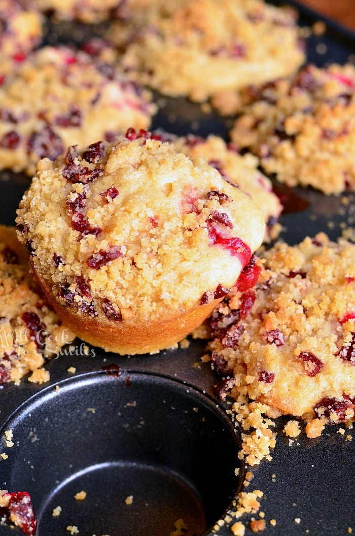 Cranberry White Chocolate Chip Streusel Muffins in a muffin tin 