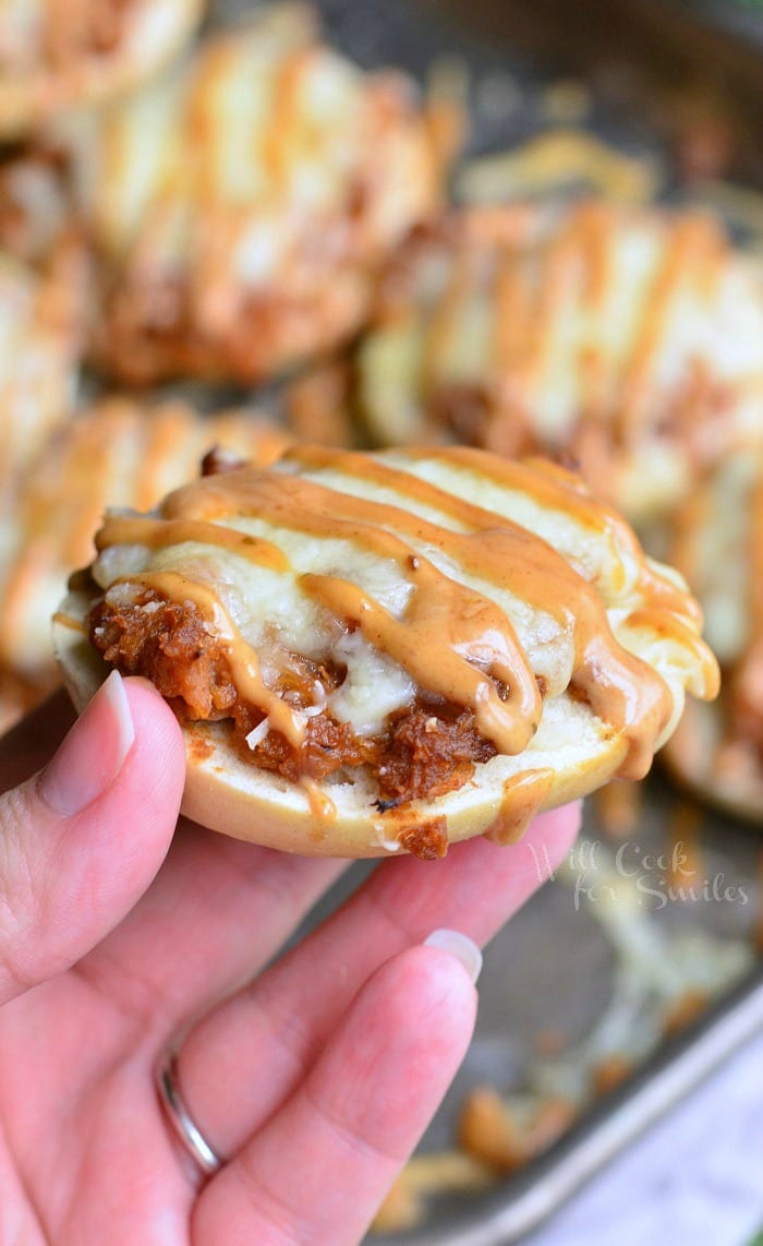 holding a Bagel with BBQ smoked chicken, Monterrey Jack and Asiago cheeses, and topped with BBQ Ranch dressing.