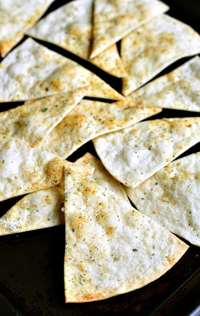 Homemade Baked Cool Ranch Tortilla Chips on a baking sheet 