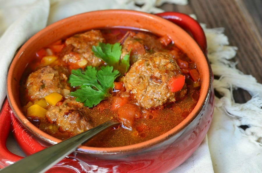 Mexican Meatballs Soup in a bowl with a spoon in it 