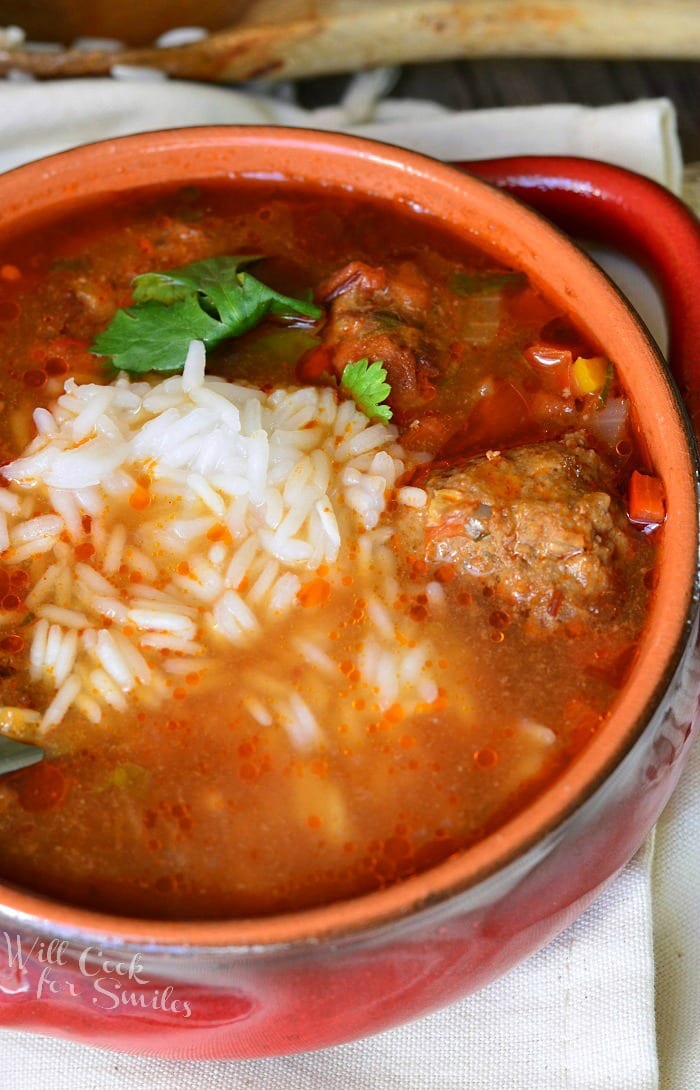 top view of Mexican Meatballs Soup with rice and meatballs in a bowl 