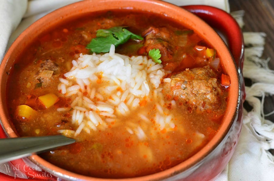 top view of Mexican Meatballs Soup with rice and meatballs in a bowl 