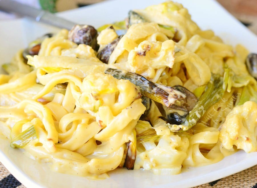 Cauliflower, Leek and Mushroom, with Fettuccine noodles in Garlic Cheese Sauce in a bowl 