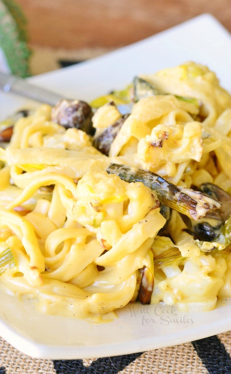 Roasted Cauliflower Leek and Mushroom Fettuccine in Garlic Cheese Sauce on a white plate 