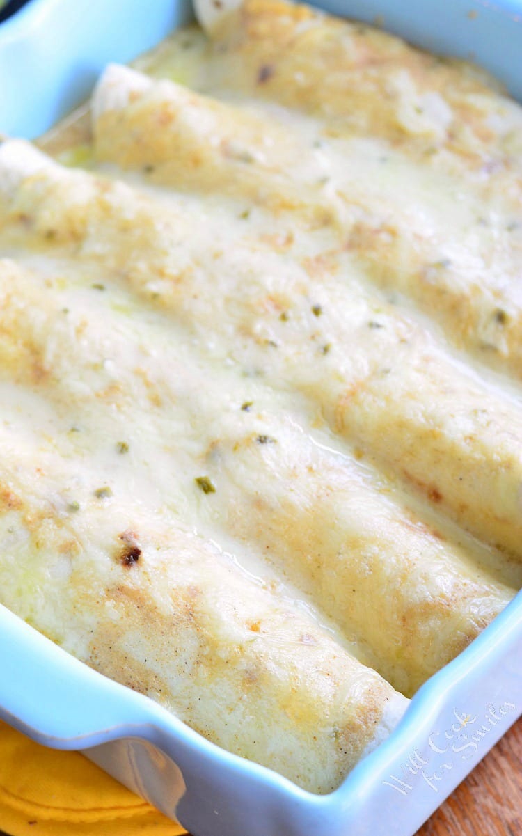 Roasted Poblano and Chicken Enchiladas in a baking dish 