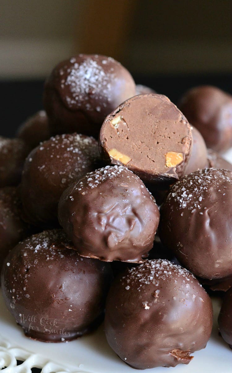 Salted Almond Fudge Truffles stacked up with one cut in half 