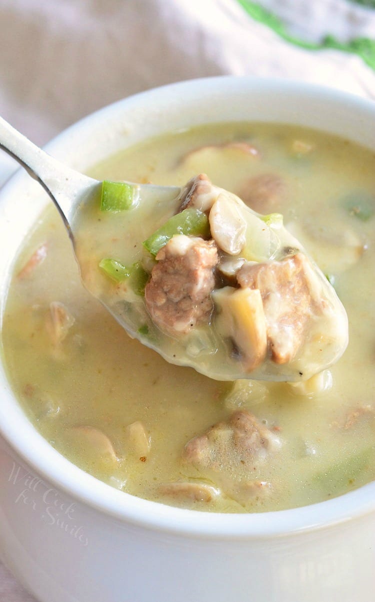 spoonful of Steak and Cheese Soup in a white bowl