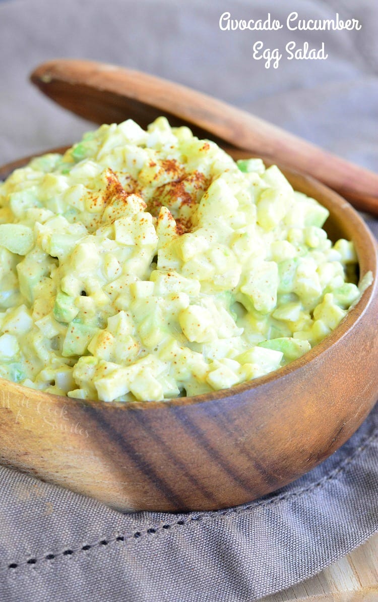 Avocado Cucumber Egg Salad in a wood bowl with a wooden spoon 