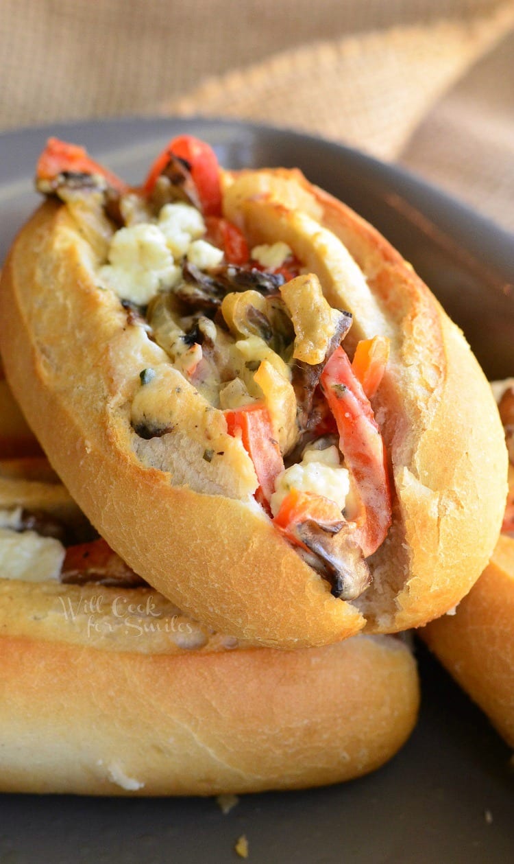 Baked Mini Veggie and Cheese Sandwiches on hoagie rolls in a baking pan 