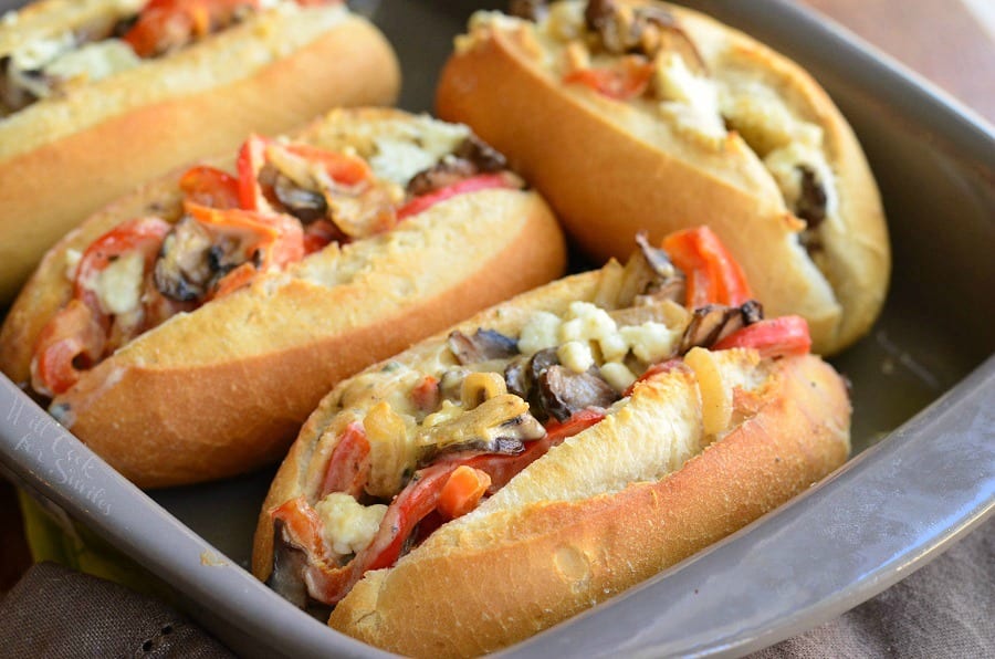 Baked Mini Veggie and Cheese Sandwiches on hoagie rolls in a baking pan 