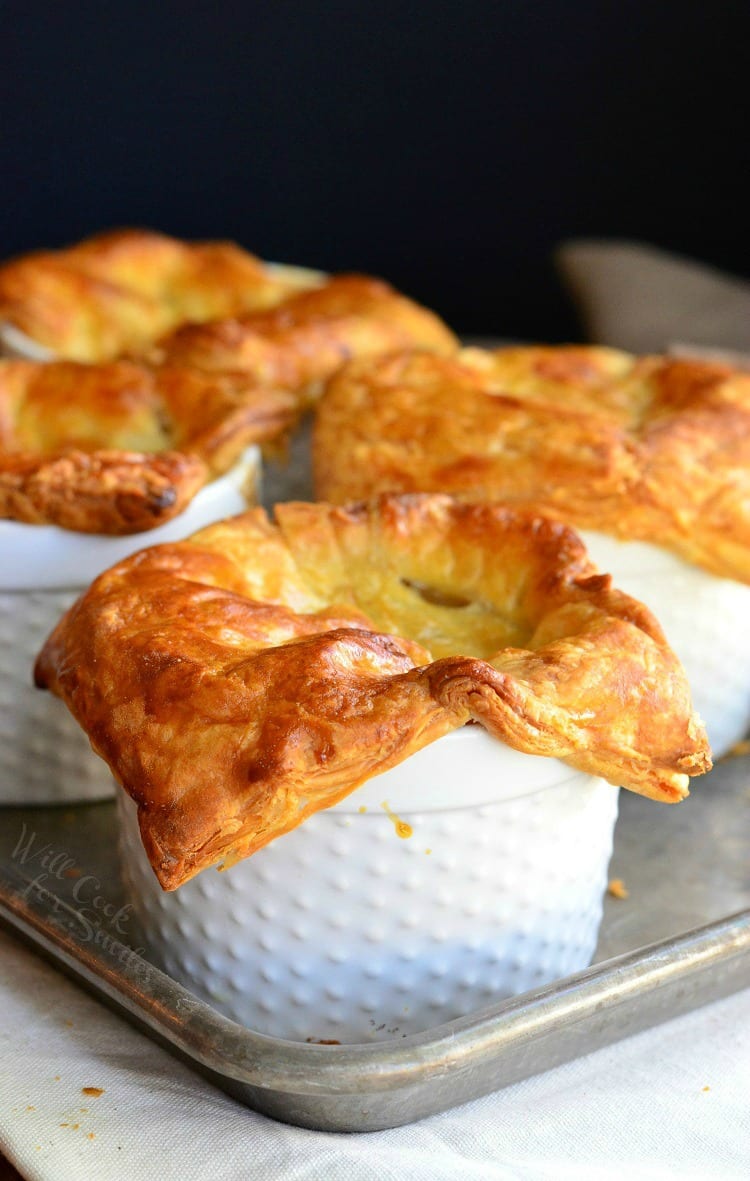 4 pot pies on a baking sheet tray