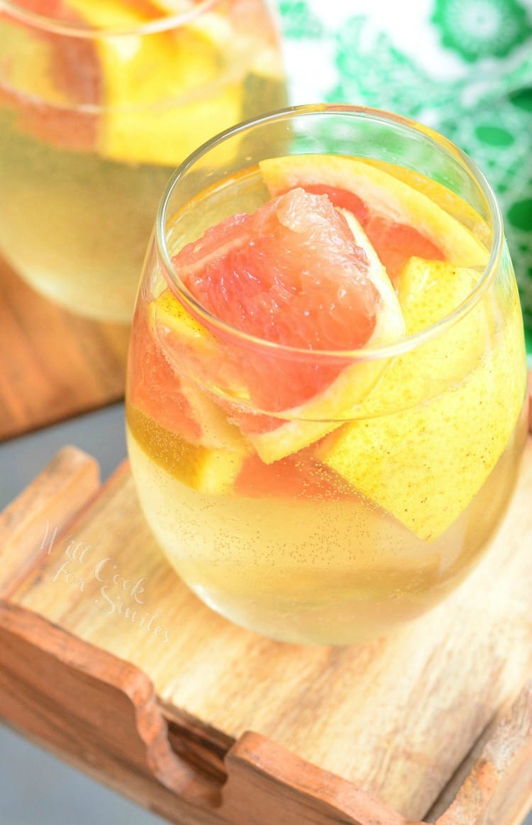 Fresh Grapefruit Sangria in a stemless wine glass with grapefruit in it 