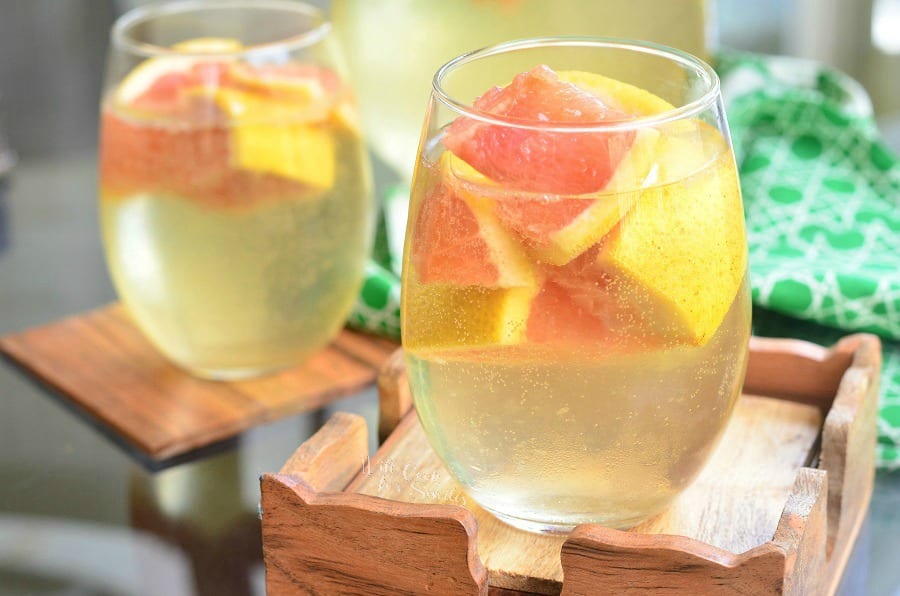 Fresh Grapefruit Sangria in a stemless wine glass with grapefruit in it 