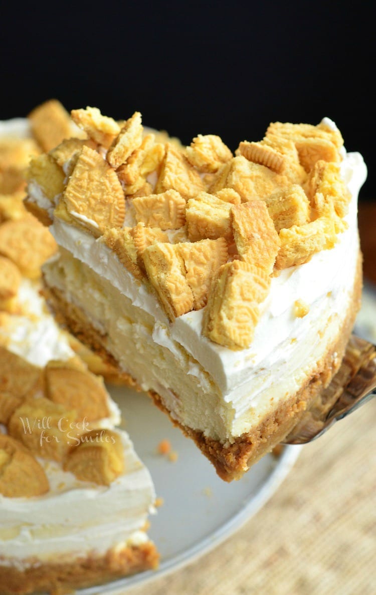 Lemon Oreo Cheesecake slice being lifted out with a pie spatula 