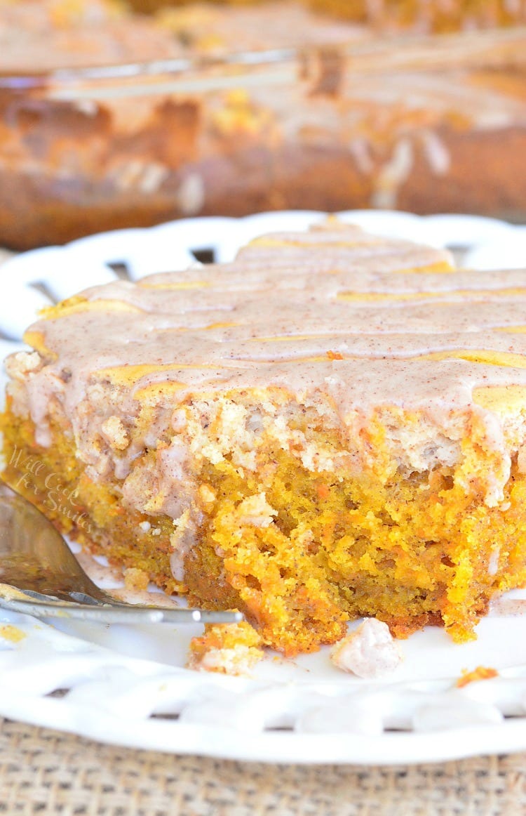 Spiced Cheesecake Swirled Carrot Cake on a plate with a fork 